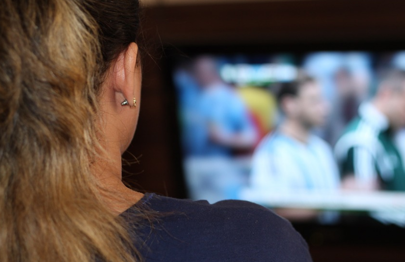 woman-sitting-in-front-of-tv
